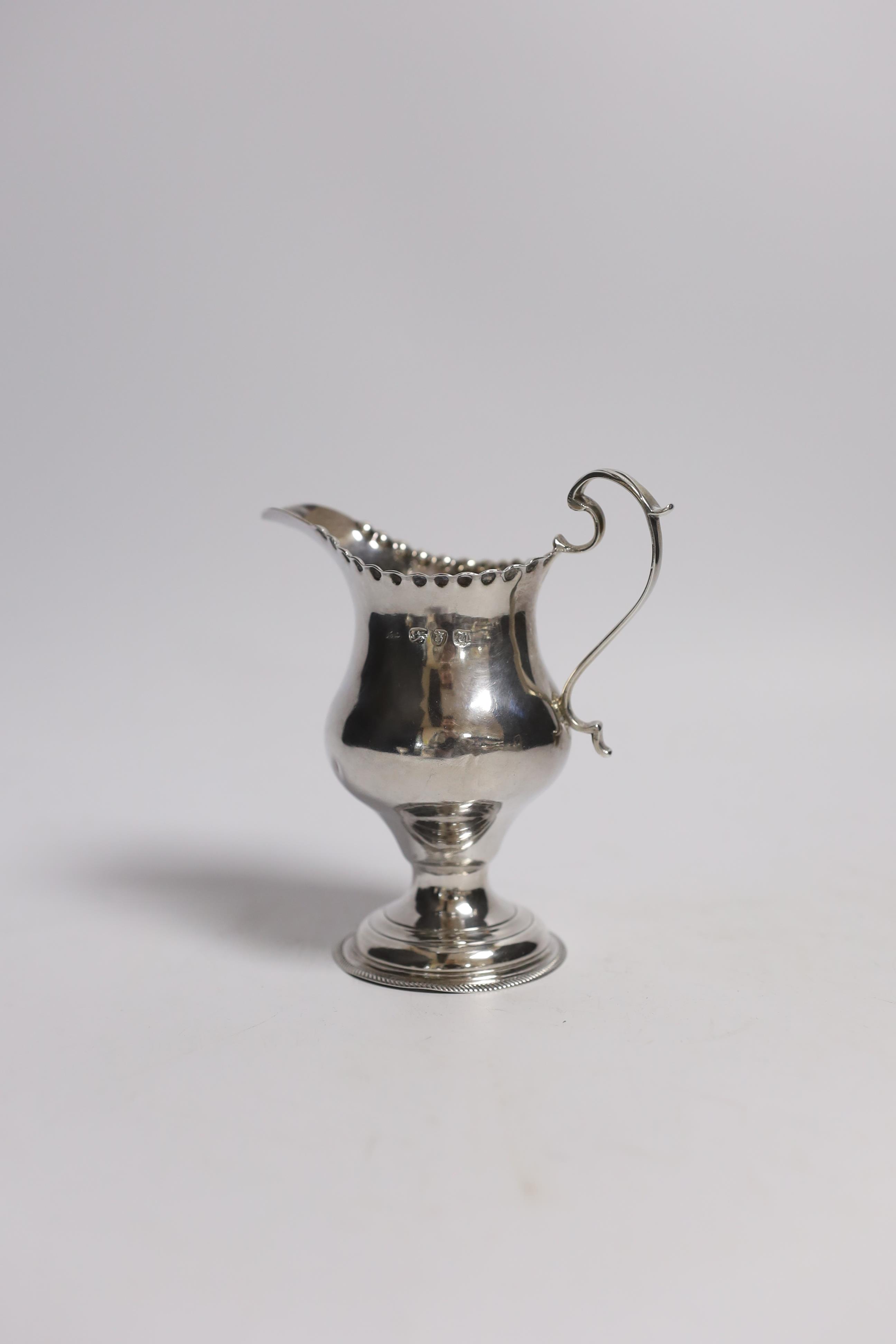 A George III silver inverted pear shaped cream jug, by Hester Bateman, London, 1775, 11.3cm.